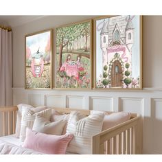 two paintings on the wall above a baby's crib in a room with pink curtains