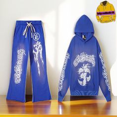 Elevate your casual wear with the Hollywood Unisex Blue Yoga Tracksuit. This stylish set features a hoodie and matching pants, both adorned with unique star and yoga-inspired logos, blending comfort with eye-catching design. Key Features: Material: Made from a soft and durable cotton blend, ensuring all-day comfort Design: Vibrant blue tracksuit featuring star and yoga-themed logos on the hoodie and pants, offering a modern and stylish look Unisex Fit: Tailored for a relaxed and comfortable fit that's suitable for all body types Versatile Style: Perfect for casual outings, lounging, or making a statement in your streetwear collection Additional Information: Processing Time: Orders are processed within 1-3 days. Shipping Time: Expect your tracksuit to arrive within 6-10 business days. Color White Tracksuit, Blue Tracksuit, Hoodie And Pants, Yoga Logo, Comfort Design, Yoga Inspiration, Yoga Pants, Casual Wear, Comfort Fit