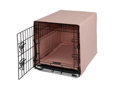 a dog crate with its door open and a pink cover over the top is shown