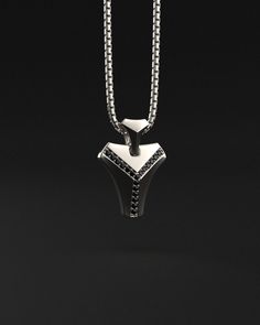 This magnificent pendant is composed of 18k white gold, includes 16 black diamonds and is completely handmade. A talisman stone is for those who want to know what life is all about. It will bring out all of your great qualities. The vertebrae that make up the human spine influenced its design. On a psychological level, this diamond represents what gives man the fortitude, bravery, drive, and unwavering belief to achieve his goals.Many people like white gold because of its silvery white hue, which gives it a refined appearance while also making it considerably more expensive than silver.White gold is impervious to rust, tarnish, and corrosion. White gold is more durable than yellow gold because it is alloyed with a combination of harder metals. Made entirely by hand with all the love and ar Luxury Black Diamond Pendant Necklace, Minimalist Sterling Silver Jewelry With Black Diamonds, Timeless Black Diamond Jewelry Gift, Minimalist Silver Jewelry With Black Diamonds, Timeless Black Diamond Jewelry For Gifts, White Gold Pendant Necklace With Black Enamel, Luxury White Gold Jewelry With Black Spinel, White Gold Necklace With Black Diamonds For Gift, Luxury Black Spinel Jewelry With Polished Finish