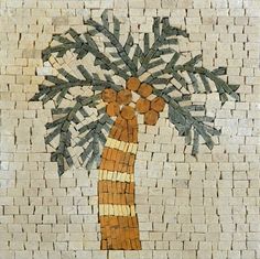 a mosaic depicting a palm tree on a white brick wall