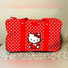 Hello Kitty Duffel Bag Carry On Overnight Travel Red Polka-Dot Tote 18" New With Tags!!! Red Polka-Dot Tote 18" Brand New With Original Tags Zippered Closure Wheels On The Bottom Red Travel Bag With Zipper For Daily Use, Red Travel Bag With Zipper Closure For Daily Use, Red Rectangular Travel Bag With Zipper, Red School Bag With Luggage Sleeve, Hello Kitty Red Bag For Everyday Use, Red Rectangular Duffle Bag With Zipper Closure, Red Rectangular Travel Bag For School, Red Hello Kitty Print Bag For Everyday Use, Red Hello Kitty Bag For Everyday Use