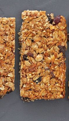 granola bars with raisins and cranberries on top are lined up next to each other