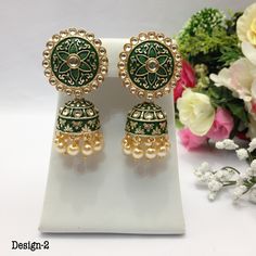 "Handmade Party Wear Polk Jhumka Earrings Pearl Imitation Minakari Indian jewelry Pakistani Bollywood Jewelry indian jewellery * Length:3\"Inches Approx  Traditional Indian Wedding Jewellery Slight Colour variations possible due to difference in screen and photograph  It is a perfect match with formal attire on special occasions or with casual wearing The item will come with the clear plastic box or plastic bag and packaging Care instructions Keep Jewellery away from direct heat, water, perfumes, deodorants and other strong chemicals as they may react with the metal or plating. The plating composition of Jewellery is as such that  perspiration (sweat) will not damage it. Wipe Jewellery gently with chamois cloth or leather swatch after every use. Wiping the jewellery with a soft cloth after Green Chandbali Jhumkas For Celebration, Green Zari Work Jhumkas For Diwali, Green Meenakari Tikka For Festivals, Festive Green Round Jhumkas, Traditional Green Kundan Jhumkas, Festive Green Jhumkas With Zari Work, Temple Jewelry Meenakari Jhumkas For Festivals, Navratri Gift Earrings With Zari Work, Heavy Green Jhumkas For Eid