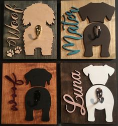 four wooden signs with dogs on them