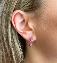 One of our designers favorites, the micro-pave pink sapphire earrings are a a classic yet trendy accessory to any outfit. Looks great combined with any of our collection of pink sapphire necklaces and bracelets. 14K & 18K Gold Yellow, rose, or white gold 2mm pink sapphires 1-1.35 cts pink sapphires 20mm diameter, 5mm width Small: 14mm x 2-2.5mm (varies slightly with each earring pair) Medium: 16mm x 4mm (varies slightly with each earring pair) 2.83 grams gold micro-pave set pink sapphires Made i Pink Earrings Outfit, Sapphire Hoop Earrings, Bezel Set Earrings, Pink Sapphire Earrings, Earrings Outfit, Signature Bracelet, Anchor Necklace, Bridal Diamond Jewellery, Herringbone Necklace