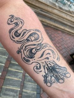 a person with a tattoo on their arm