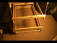 a wooden chair sitting on top of a carpeted floor