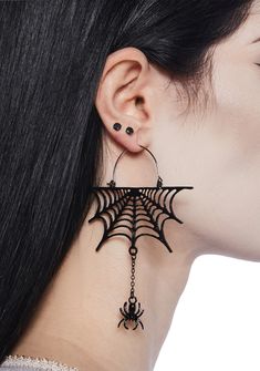 Look spooky in these drop earrings that have web and dangling spider charms. Edgy Pierced Halloween Earrings, Edgy Pierced Earrings For Halloween, Edgy Halloween Pierced Earrings, Edgy Dangle Earrings For Halloween, Edgy Drop Earrings For Halloween, Edgy Halloween Drop Earrings, Black Edgy Dangle Earrings, Edgy Black Dangle Earrings, Spooky Black Earrings For Party