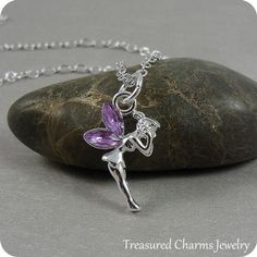 This Fairy Charm necklace comes on a silver-plated chain that is available in different lengths. Please choose your desired length from the drop-down menu when placing the item in your shopping cart. { CHARM DETAILS }★ Material: Pewter with Purple Crystal Accents★ Finish Color: Silver★ Measurements: 1/2" x 3/4"★ Dimensions: One-sided★ Made in the USA{ SIMILAR ITEMS } More fairy themed items available from my shop: https://www.etsy.com/shop/treasuredcharms/search?search_query=fantasy{ GIFT OPTION Silver Fairy Grunge Dangle Jewelry, Fairy Grunge Silver Dangle Jewelry, Silver Fairycore Necklace, Whimsical Silver Dangle Charm Necklaces, Silver Fairy Grunge Necklace As A Gift, Silver Fairy Grunge Necklace For Gift, Fairy Style Silver Jewelry For Gift, Fairy Charm Necklace, Purple Wings