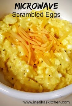 scrambled eggs with cheese in a white bowl