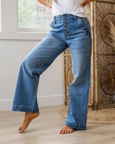 KanCan Sienna Non Distressed Wide Leg Jeans Medium wash Button up Non distressed Trouser hem Straight fit Wide leg Okay stretch 99% Cotton 1% Spandex Imported Sizing: 1/24, 3/25, 5/26, 7/27, 9/28, 11/29, 13/30, 15/31 Model is wearing a size 3 True to size for KanCan Straight Fit - size up if you are between sizes Need more sizing help? Check out our Jeans Sizing Guide here Measurements on size 3:Rise: 12" (high rise)Inseam: 31"Leg opening: 10" Waist: 13" Non-stretch Wide Leg Flare Jeans With Button Closure, Stretch Bottoms With Button Closure In Light Wash, High Waist Relaxed Fit Flare Jeans With Button Closure, Relaxed Fit Wide Leg Jeans With Buttons, Non-stretch Cotton Jeans With Buttons, Spring Wide Leg Flare Jeans With Buttons, Stretch Dark Wash Bottoms With Button Closure, Stretch Bottoms With Button Closure In Dark Wash, Casual Stretch Button-up Bottoms