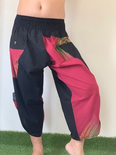 "Male Model Tall 5'9\" Waist 34\" Samurai Pants - elastic waistband and cuffs - Fits all! Unisex pants These beautiful casual pants is unique & comfortable to wear Handmade with a very lovely pattern, it is easy to wear and great for many occasions. One size fits most. These pants are great for many different activities like traveling, dancing, going to festivals, rock climbing, yoga, meditation, massage, working out, martial arts, Taichi MATERIAL: 100% Cotton APPROX MEASUREMENT: Waist: 24\" Black Patchwork Bottoms For Festival, Traditional Pants With Elastic Waistband For Festivals, Traditional Multicolor Bottoms With Elastic Waistband, Traditional Wide Leg Parachute Pants For Festivals, Traditional Black Harem Pants With Elastic Waistband, Traditional Wide-leg Parachute Pants For Festival, Traditional Pants With Pockets For Festival, Traditional Harem Pants With Pockets For Festivals, Traditional Pants With Pockets