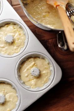 a muffin tin filled with cupcake batter