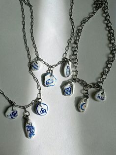 This unique necklace features handmade clay charms, crafted and hand-painted in a ceramic style with a beautiful blue pattern inspired by nature and traditional art. Each piece is carefully sculpted and decorated, making every necklace truly one-of-a-kind. Clay Charm Necklace, Ceramic Style, Painted Clay, Ceramic Necklace, Polymer Clay Necklace, Charm Necklaces, Diy Clay Crafts, Unique Necklace, Handmade Clay