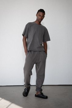 A staple in every wardrobe. The Core Sweatpant is made of 12 oz cotton with a vintage-inspired, baggy silhouette. Includes elasticized hem cuffs, drawstring waistband, and side pockets. Pair it with one of our Core sweatshirts to complete your matching lounge set. 100% ORGANIC COTTON 12 OZ BRUSHED TERRY STANDARD FIT HIGH RISE GARMENT WASHED Washed Black Sweatpants With Pockets For Streetwear, Washed Black Relaxed Fit Cotton Sweatpants, Relaxed Fit Washed Black Cotton Sweatpants, Washed Black Cotton Relaxed Fit Sweatpants, Gray Cotton Sweats With Side Pockets, Oversized Cotton Joggers With Ribbed Cuffs, Washed Black Sweatpants With Pockets For Loungewear, Cotton Sweatpants With Ribbed Cuffs For Casual Wear, Cotton Sweatpants With Ribbed Cuffs For Elevated Casual Wear