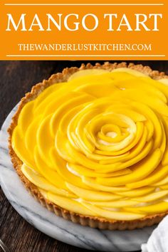 mango tart on a marble plate with text overlay that reads mango tart