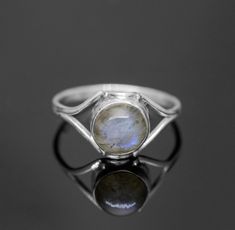 Sterling Silver 925 Round Labradorite Gemstone Ladies Ring Face Size: 10mm height Stone Size: 7mm 925 Stamped Comes beautifully presented in a Gift Box and Gift Bag Please note: Because these beautiful pieces are handmade, each piece is unique and therefore no two items are exactly the same.   Also, because the stones are all unique, stone colours/patterns may vary slightly. If you do not require the packaging (gift box, gift bag etc) then please leave a note at checkout and i will not include it.! Gift Moonstone Ring In Sterling Silver, Silver Moonstone Ring With Bezel Setting As Gift, Minimalist Round Labradorite Jewelry, Round Labradorite Moonstone Ring Stamped 925, Round Labradorite Ring As Gift, Round Labradorite Anniversary Jewelry, Ring Elegant, Packaging Gift, Ladies Ring