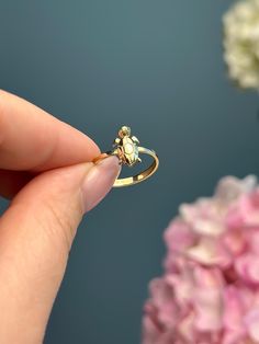 This turtle-shaped ring is a whimsical and charming piece of animal-themed jewelry. With intricate details that capture the essence of a turtle, it's a stylish way to showcase your love for these fascinating creatures and add a touch of nature-inspired flair to your style. Product Specifications:  * Material: 14K Solid Gold, hallmarked 14K or 585 for authenticity Delivery:  * Ready to ship in 1 business day. * Delivers in 1 to 5 days depending on location and delivery option. * Returns are accepted within 7 days from the delivery date, at the customers cost. Gift Option: * We cherish the joy of gifting, as do you and your loved ones. Feel free to inform us if            you desire an additional personalized note with your order to make it an even more            special gift. Explore Our O Animal Themed Jewelry, Turtle Ring, Hand Painted Necklace, Italy Gift, Animal Ring, Animal Rings, A Turtle, Themed Jewelry, Intricate Details