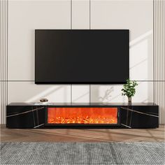 a modern fireplace in the middle of a room with a flat screen tv above it