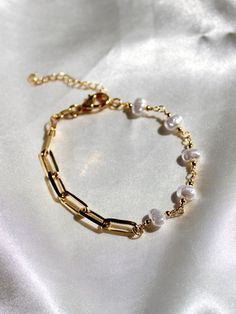 18k gold filled bracelet. Half paperclip chain, half genuine fresh water pearls.  7 inch bracelet with a 1.5 inch extender chain. Luxury Dainty Yellow Gold Pearl Bracelet, Gold Paperclip Bracelet With Pearl Chain As A Gift, Elegant Paperclip Bracelet With Pearl Chain, Elegant White Paperclip Bracelet For Gift, Elegant White Paperclip Bracelet Gift, Gold Pearl Bracelet With Extender For Everyday Use, Gold And Pearl Bracelet, Paperclip Bracelet, Diy Beaded Rings