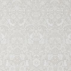 a white wallpaper with an intricate design on it