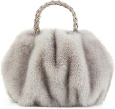 This handbag is made with luxuriously soft faux fur and features a braided handle, making it both fashionable and comfortable. The beige color complements any outfit for a look that is effortlessly elegant. The outside of the tote bag is smooth and soft artificial fur,Simple and environmentally friendly. 11.3 x 10.55 x 3.66 inches Chic Evening Shoulder Bag With Faux Fur Lining, Luxury Faux Fur Evening Bag, Luxury Evening Bags In Faux Fur, Elegant Evening Shoulder Bag With Faux Fur Lining, Winter Evening Bag In Faux Fur, Luxury Bags With Faux Fur Lining For Winter, Winter Evening Bags In Faux Fur, Winter Evening Bags With Faux Fur, Elegant Winter Shoulder Bag With Faux Fur Lining