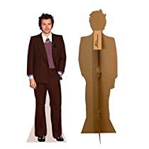 a cardboard cutout of a man standing next to a dummy