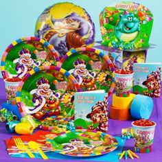 an assortment of children's party supplies including plates, cups and napkins