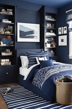 a bedroom with blue walls and white bedding in the center, along with bookshelves