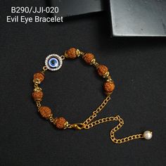 Evil Eye Bracelet, Protection Bracelet, Indian Jewelry, Dainty Beaded Bracelet, Gift For Her/Him, Delicate Bracelet, Rudraksha Bracelet A Rich and Elegant Rudraksha Evil Eye bracelet, detailing is a perfect accessory for your occasion. This necklace is handcrafted with stones and brass along with high-quality polish *Bracelet Length: 6 Inches (approx, adjustable) *Package: 1 bracelet *Material: Brass, stone *Care: Store in an airtight plastic bag or box. Keep away from water, moist place & fragrance For Express shipping, the option is available in the drop-down menu at checkout. If you need any help regarding placing an order or express shipping, feel free to message us ☆DISCLAIMER: This product is made to order. Product color may slightly vary due to photographic lighting sources or your Adjustable Spiritual Chain Bracelet, Spiritual Adjustable Chain Bracelet, Rudraksha Bracelet, Bracelet Indian, File Decoration Ideas, Daily Wear Jewellery, Jewelry Dainty, Protection Bracelet, Eye Bracelet