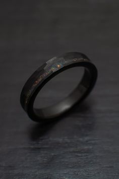 Our gorgeous 4mm Black Obsidian-style Hammered Tungsten Wedding Ring with an beautiful bello balck opal inlay. + Comes in a handmade wax-sealed Ring Box *Durable - Incredible Scratch Resistant Performance to always look great. *Comfort-fit & Weighty - Designed to fit well and feel good in your hand. *Made to order - Every ring we ship is unique and one-of-a-kind. *4mm - Popular Standard width *Hypoallergenic - No discomfort from metals. *Cobalt-Free - Will never turn your finger green or irr Men’s Engagement Rings Black, Male Wedding Bands Tungsten, Obsidian Ring Mens, Masc Ring, Masc Engagement Ring, Masc Rings, Black Wedding Rings For Men, Black Wedding Bands For Men, Black Ring Band