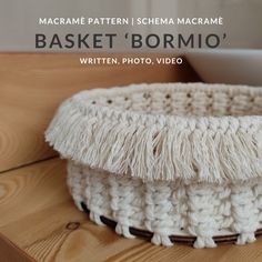 a crocheted basket sitting on top of a wooden table