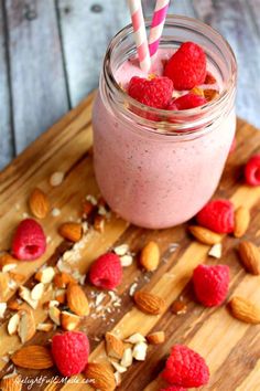 a smoothie with raspberries and almonds in a mason jar