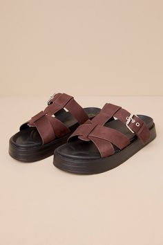 Create looks that are always chic and ready for fun with the Lulus Surie Chocolate Suede Strappy Flatform Slide Sandals! Soft, faux suede leather shapes these must-have sandals that feature an almond-shaped footbed and a cage-style upper composed of crisscrossing straps and an adjustable vamp strap that secures with a silver buckle detail. A .5"" contoured insole and a trendy flatform sole complete the sleek slide-on design! Available in whole sizes only. 1" flatform sole. Lightly cushioned cont Summer Suede Footbed Sandals With Leather Footbed, Summer Suede Sandals With Leather Footbed, Summer Suede Platform Footbed Sandals, Casual Suede Platform Sandals, Trendy Suede Sandals With Round Toe, Suede Platform Sandals For Vacation, Suede Footbed Sandals With Textured Footbed For Summer, Summer Suede Footbed Sandals With Textured Footbed, Beach Suede Platform Footbed Sandals