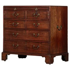 an old wooden dresser with brass handles on it's doors and drawer drawers, isolated against a white background