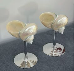 two wine glasses sitting on top of each other