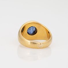 This is part of Chairish’s Fine Jewelry assortment.  Stylish vintage natural Ceylon sapphire signet ring (circa 1990s) crafted in 18 karat yellow gold.   Oval mixed cut natural sapphire measures 8.5mm x 7.8mm x 6.6mm (estimated at 3.50 carats). The sapphire is medium blue in colour, lightly included, good cut and bezel set in the centre. Colour and inclusions are typical of sapphires from Ceylon (Sri Lanka). There is no evidence of any treatments to the stone.     Included with the purchase of t Sapphire Signet Ring, Ceylon Sri Lanka, Ceylon Sapphire, No Heat, Late 20th Century, Natural Sapphire, Signet Ring, Bezel Setting, Medium Blue