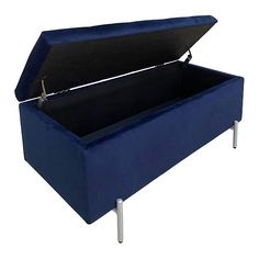 a blue velvet storage bench with metal legs and an open lid on the back side