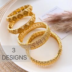 These bangles gold plated stacking gold bangles / gold bracelet are a perfect gift for a special women. Treat yourself or a loved one. These unique bangles will enhance any outfit. Trendy Designed Suitable for all Occasions, Wedding, Party, Engagement , Bridle  Jewelry, Birthday Gift Size: 2.45 inches width : 1.6cm 24K Gold Plated High quality Not a  solid Gold can open for easy use These are made of high quality materials 24K gold plated and it will NOT tarnish nor discolor for a long time. High quality gold plated jewelry is a great alternative to solid gold jewelry.  very affordable price. This item is hypoallergenic so it won't irritate sensitive skin. Suitable for all occasions 🦋Jewelry Care:  As with all pieces that are not real gold, it is advised that you take proper jewelry care Gold-plated Round Cuff Bracelet, Stackable Gold Plated Bangle Bracelet, Stackable Gold Plated Gold Bracelets, Elegant Stackable Bangle For Festive Occasions, Gold Bangle Bracelets For Festive Occasions, Gold-plated Bangle Bracelet With Intricate Design, Gold Plated Bangle Bracelet With Intricate Design, Gold-plated Bracelets With Intricate Design, Gold Plated Bangle With Intricate Design