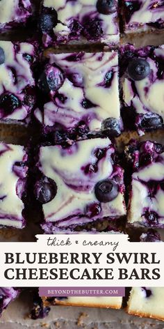 blueberry swirl cheesecake bars cut into squares and stacked on top of each other