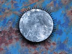 an old metal object on a blue and rusted surface