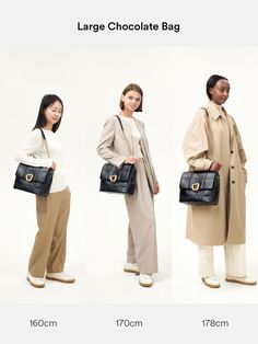 three models in trench coats carrying large bags