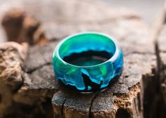 "Animal ring for men and women| Glow in the dark| Green wood wolf ring | magic engagement bands jewelry| best gift for girl for boyfriend  Materials: wood,  jewelry resin, epoxy resin, walnut size: Inner diameter from 15 to 24 mm Ring made of wood and epoxy resin \"Polar Night\" from GreenWood. Looking inside, you will certainly see a fabulous world with magical air bubbles that will attract the eyes of others. The ring is made of black hornbeam and jewelry resin. Recommendations for care The ri Wolf Design Ring Jewelry Gift, Wolf Design Ring Jewelry For Gift, Luminous Ring Jewelry For Gifts, Luminous Ring Jewelry As A Gift, Wood Costume, Mystery Jewelry, Resin Paintings, Ring Magic, Wood Fashion