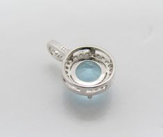 Vintage Sterling Silver Round cut Aquamarine & White Topaz Pendant...Marked 925...Total of weights 1.5grams...Measure of stone 7.5MM...Measure of Pendant H 5/8'' W 3/8''...It's in very good condition. Round Topaz Gemstones With Prong Setting, Blue Topaz Round Stone Jewelry With Prong Setting, Round Blue Topaz Gemstones With Prong Setting, Blue Topaz Jewelry With Prong Setting, Silver Round Blue Topaz Gemstones, Round Silver Blue Topaz Gemstones, Silver Blue Topaz Gemstones, Round Shape, Silver Blue Topaz Round Gemstones, Topaz Pendant