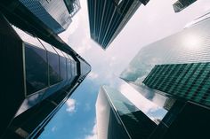 looking up at tall buildings in the city