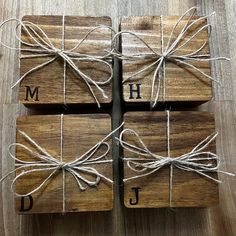 four wooden coasters tied up with twine and monogrammed letters on them