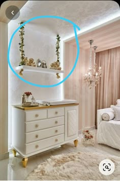 a white dresser sitting next to a bed in a bedroom under a round blue light