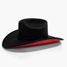 Black Cowboy Hat with Red Under Brim by AB.LION Western meets contemporary. Our take on a western classic, made from the same materials used on our flagship rancher hat, with a red under brim. Trimmed with a Minimal Mexican Suede Hat Band. Made from stiffened Mexican suede Spot / specialist clean Brim width: 4″ / 10.16 Black And Red Cowboy Hat, Cowboy Vampire, Red Cowboy Hat, Biker Wedding, Black N Red, Concert Makeup, Black Cowboy Hat, Reference Board, Dutton Ranch