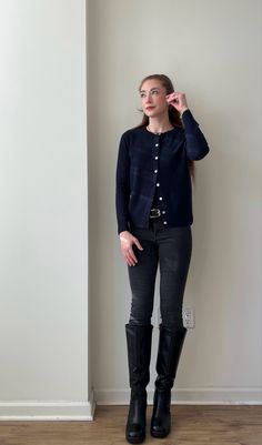 Styling skinny jeans in 2025! Inspired by equestrian style. I’m wearing tall black boots, gray skinny jeans, a navy blue cardigan, black belt, and gold jewelry. Casual, neutral outfit for fall/winter.